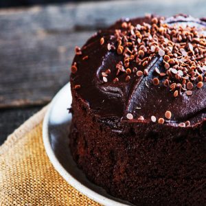 A freshly cooked chocolate cake with a creamy icing.
