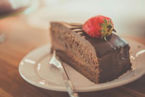 A freshly cooked chocolate cake with a creamy icing.
