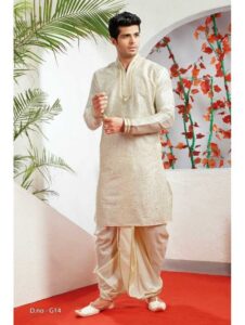 A groom in a nice summer wedding attire, standing outside.